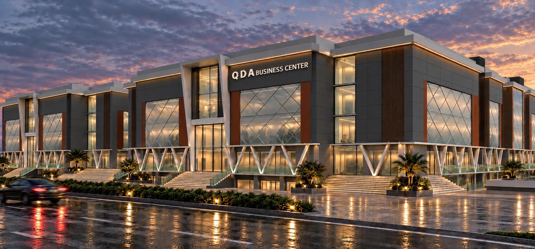 QDA Business Center — corner façade at golden hour