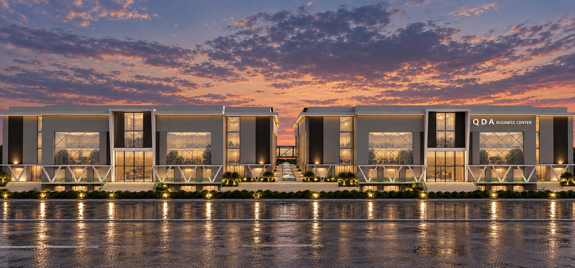 QDA Business Center — front elevation at dusk